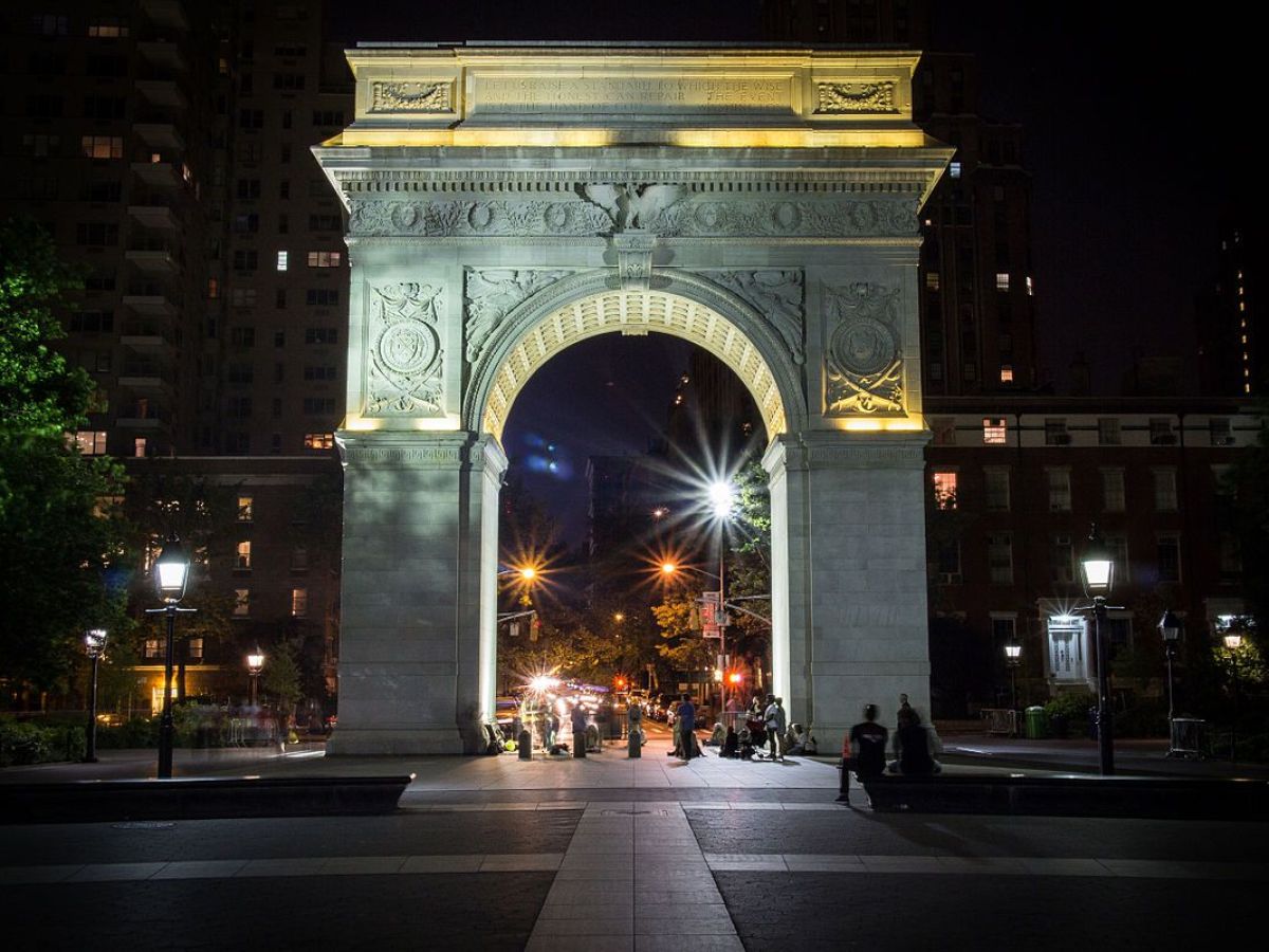 a view of Washington Square Park at night