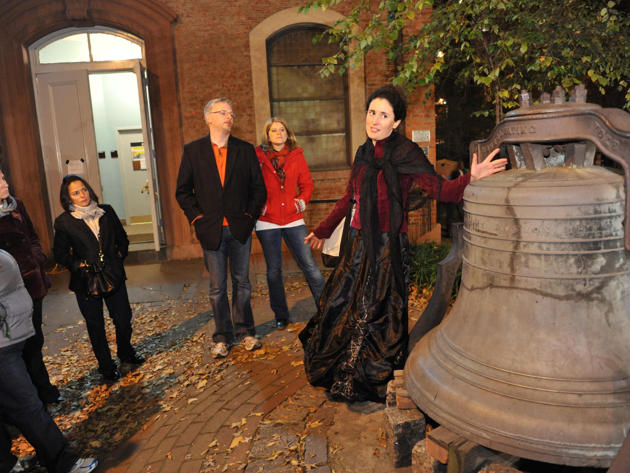 a group of people standing in front of a building