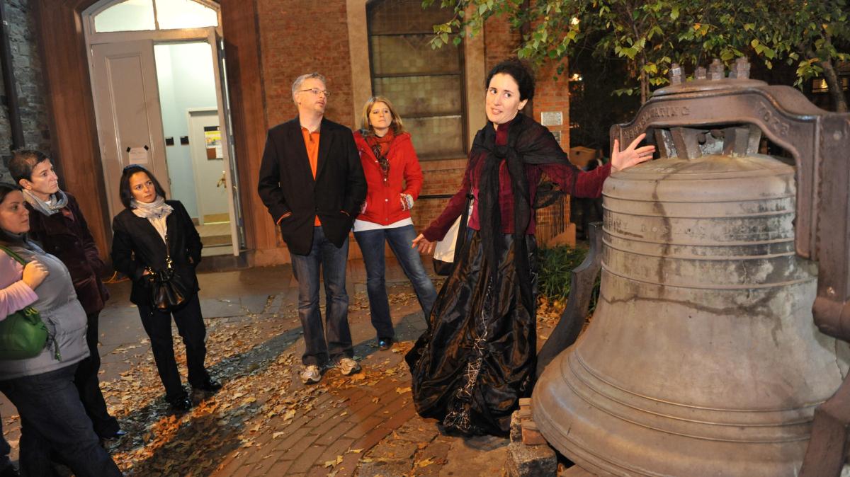 a group of people standing in front of a building